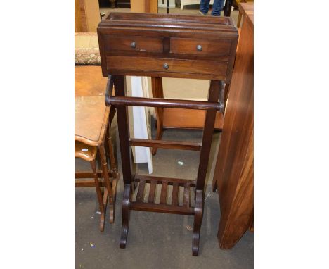 A modern hardwood valet suit stand