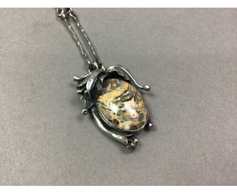 WHITE METAL AND HARDSTONE PENDANT MID-LATE 20TH CENTURY the mount with leaf motif and set on an unmarked fancy link chainthe 