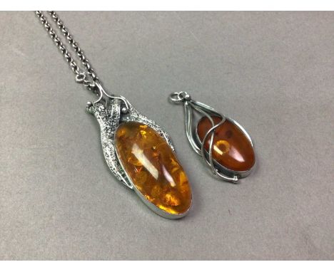 TWO POLISH BALTIC AMBER PENDANTS LATE 20TH CENTURY the larger marked and suspended on a belcher link chain