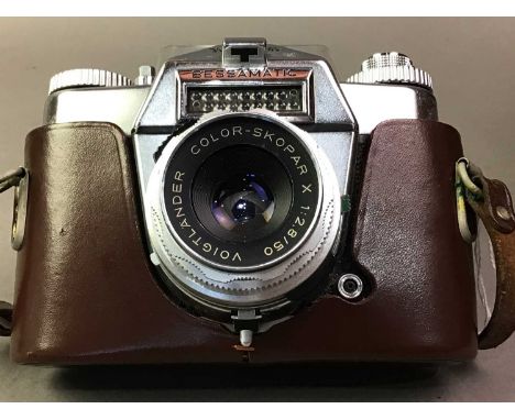 VOITLANDER BESSAMATIC SLR CAMERA WITH LEATHER CARRYING CASE contained in a larger leather carry case with some accessories