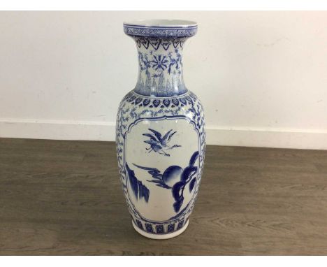 CHINESE BLUE AND WHITE VASE with a panel depicting birds61cm high