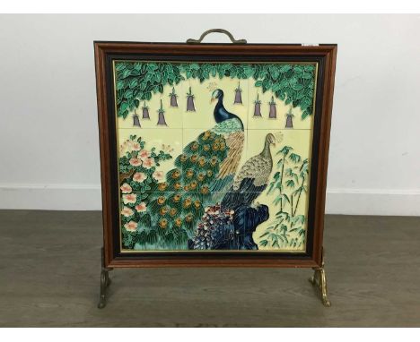 MAHOGANY FIRESCREEN  fitted with six tiles depicting a peacock, on brass stand62cm high