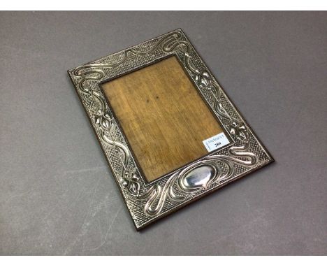 EDWARDIAN SILVER MOUNTED PHOTOGRAPH FRAME CHESTER 1906 with Art Nouveau design in relief, oak easel back31cm x 32cm Some dama