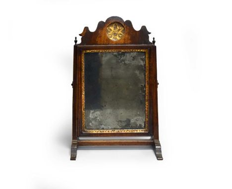 A small 18th century fret type table mirror, with gilt floret boss to the fret cut cresting, set in a rectangular section sta