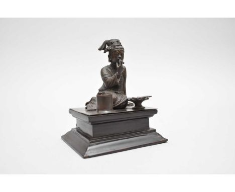 A bronze figure of a Burmese girl, probably French or Austrian, late 19th century, modelled seated and wearing traditional ro