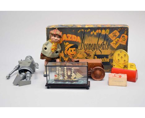 A collection of vintage toys including a Tri-Ang  clockwork tractor, Mazda Disneylights, boxed, Super Soccer, boxed, and othe