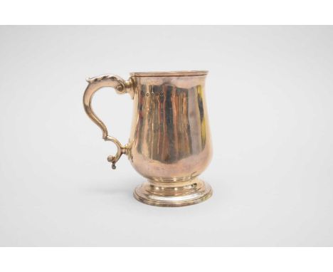 A George III silver baluster mug, Peter, Ann &amp; William Bateman, London 1804, with acanthus leaf capped scroll handle and 