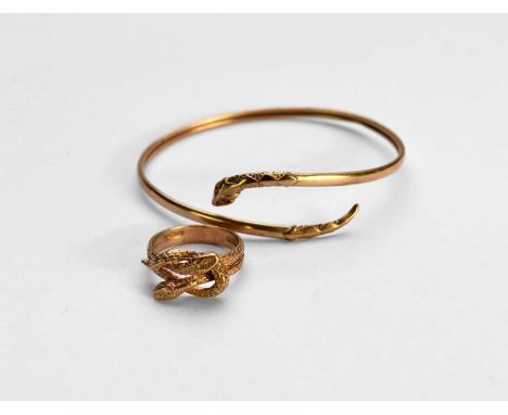 A 9ct gold entwined double snake ring, hallmarked London 1981, ring size M 1/2, together with a 9ct gold snake form bangle, t