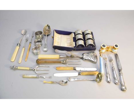 A cased set of six silver napkin rings, together with four further silver napkin rings, a pair of Dutch silver asparagus tong