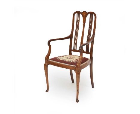 An Edwardian inlaid mahogany open armchair, the inlaid top rail over narrow baluster splat flanked by openwork spindles, down