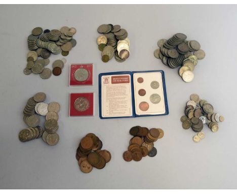 An assorted collection of British and Foreign silver, cupro-nickel and bronze coinage