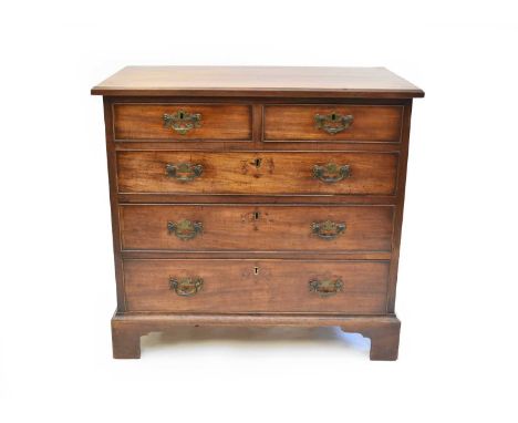 A George III mahogany chest of two short over three long drawers, the moulded top above two short and three long cock-beaded 