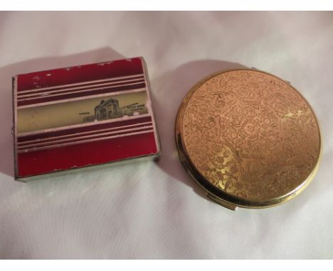 A vintage Stratton compact (mirror a/f), and a push out compact depicting the Ypres Menin Gate.
