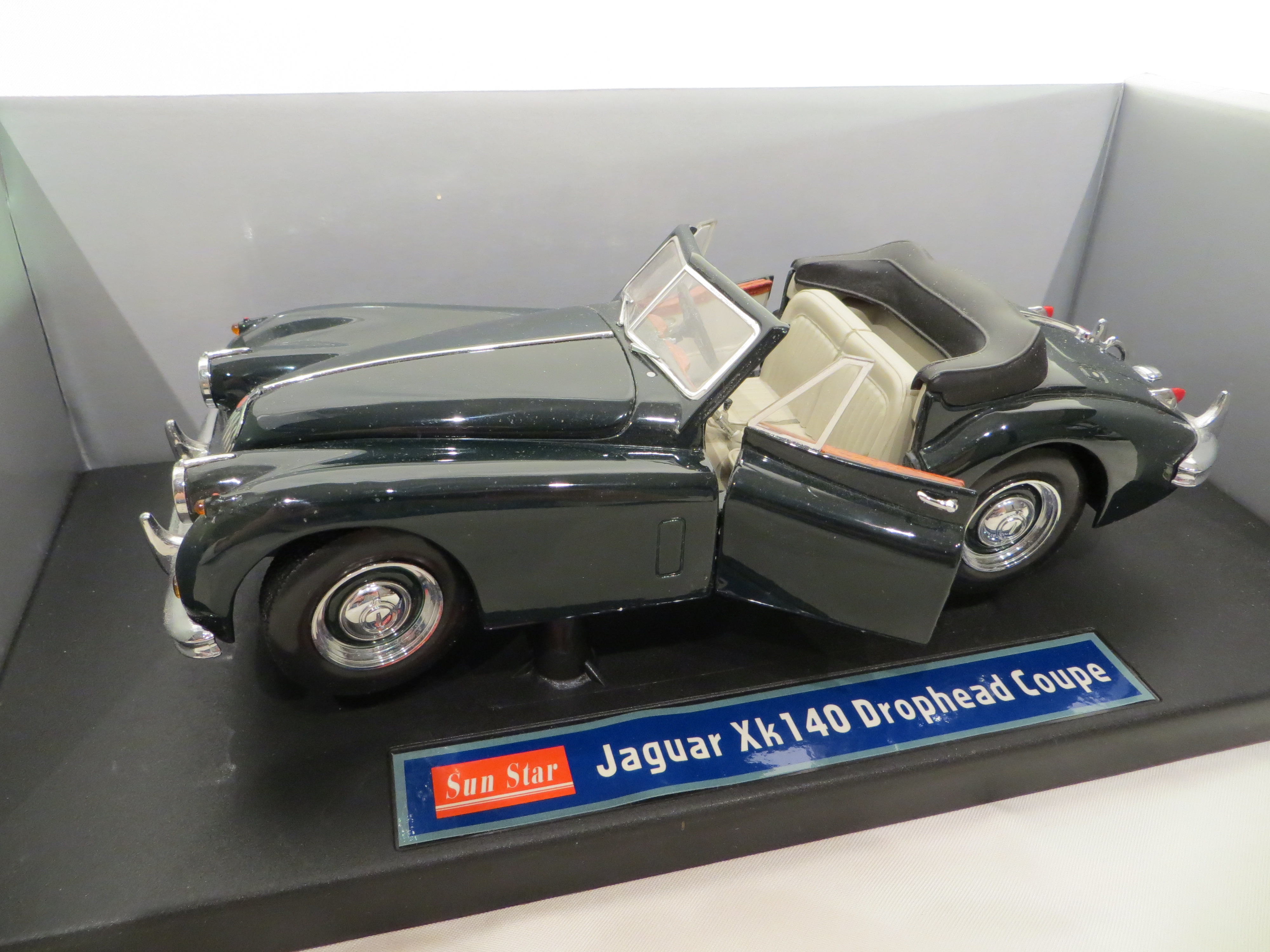 A Jaguar XK140 Drophead Coupe die cast metal model car by Sun Star