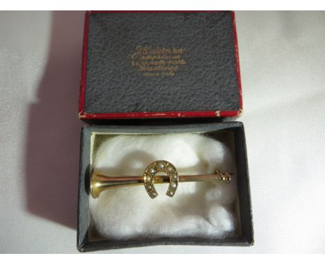 A 9ct gold Victorian hunting horn brooch with seed pearls. Boxed. Gross weight: 1.6g