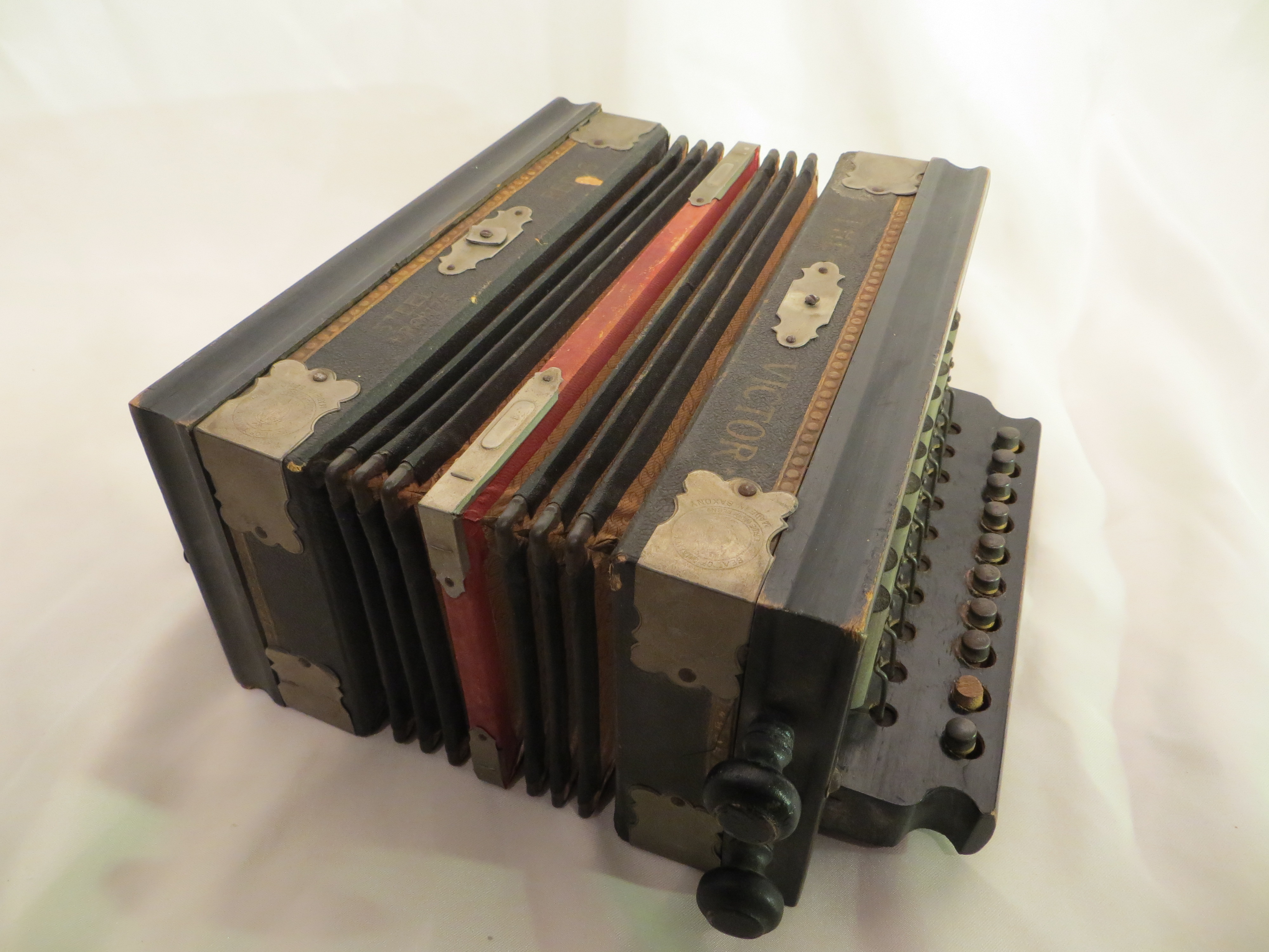 A vintage accordion / squeeze box "The Victor"