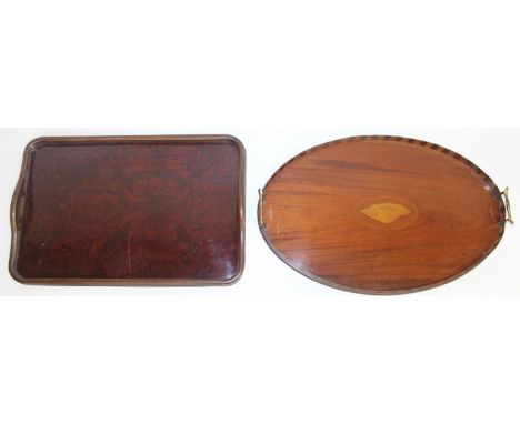 Two wooden serving trays to incl an Edwardian Sheraton Revival example with centre shell detail and brass handles, and anothe