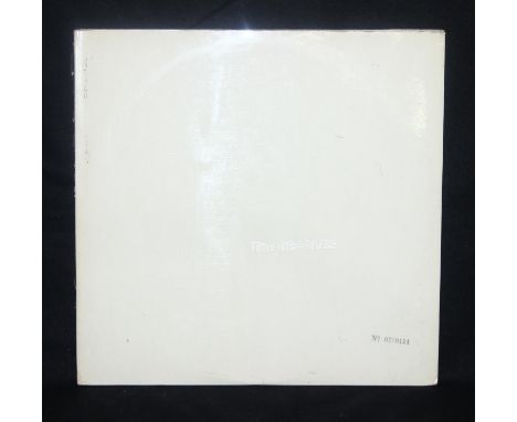 The Beatles "White Album" vinyl LP numbered 0209124 with original inner sleeves, booklet and set of four photos