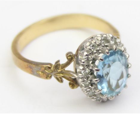 [4.74g, O] - an antique style 18ct gold and aquamarine ring, the central aquamarine stone assessed as 1.46ct surrounded by fi