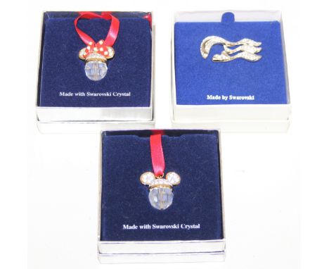 Three pieces of Swarovski jewellery, a Princess range brooch in box and two Disney related necklaces depicting Minnie &amp; M