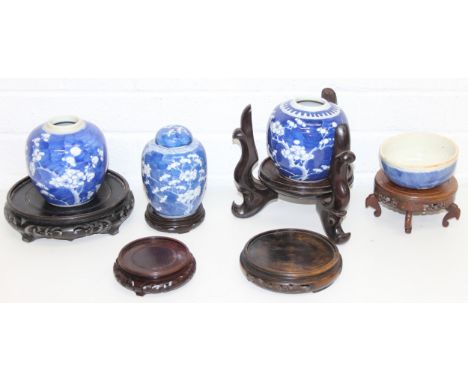 Six assorted Chinese carved wooden vase stands, three Chinese blue &amp; white porcelain ginger jars decorated with prunus bl