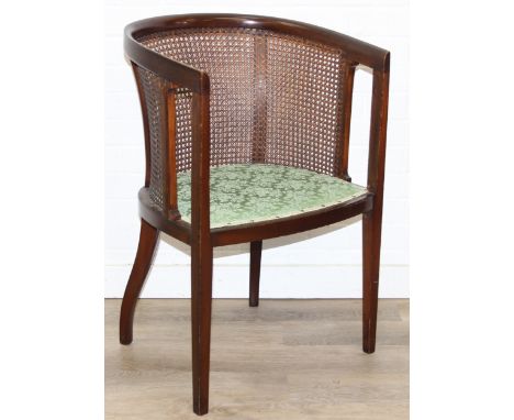 An Edwardian mahogany framed tub chair with bergere back and green upholstered seat, 52cm wide x 81cm tall