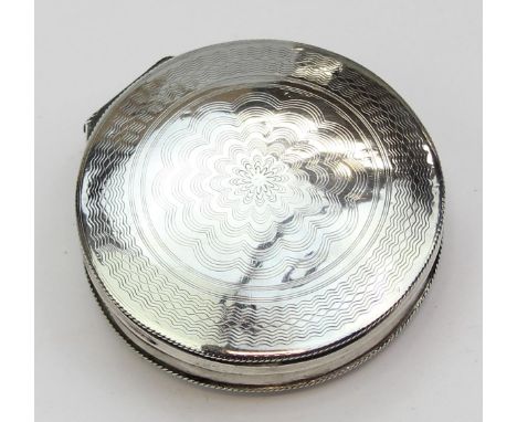 An antique silver snuff box, circular form with engraved decoration, indistinctly marked but XRF confirmed as 85% silver, pos