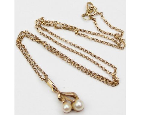 [2.22g] - a 9ct gold and seed pearl pendant on 9ct gold chain, the chain marked and all pieces XRF confirmed, 40cm long