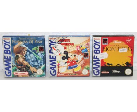 Nintendo Game Boy games: Disney's The Lion King, Mickey's Dangerous Chase (German packaging), and Wizards &amp; Warriors X Fo