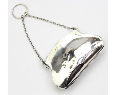 An antique silver purse or evening bag of plain form, Birmingham 1915 by F H Adams Ltd, with leather lined interior and suspe