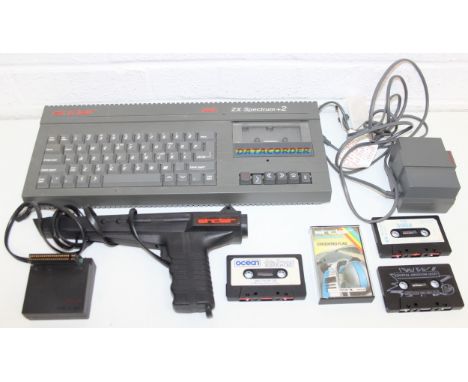 Vintage Sinclair 128K ZX Spectrum +2 with light phaser gun and some games cassettes 