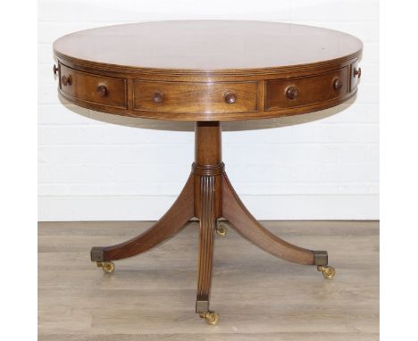 An antique style drum or library table with inlay, four real drawers and four faux drawers, 91cm in diameter x 77cm tall