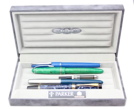 A vintage Parker Duofold fountain pen with blue marbled finish and 18ct gold nib, 13cm long, with box and three further fount
