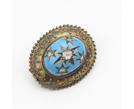 [7.06g] - an unusual Victorian Etruscan Revival brooch set with gold filigree work and a turquoise blue enamel or glass caboc