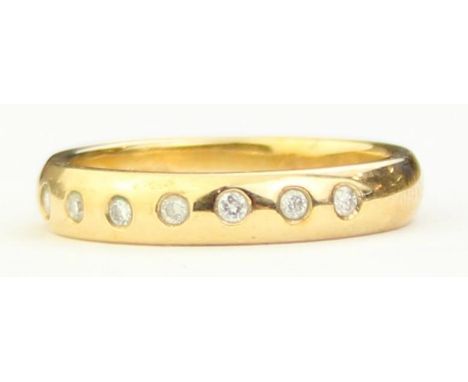 [3.25g, M] - a modern Italian 9ct gold half eternity ring set with seven small diamonds, indistinctly marked but XRF confirme