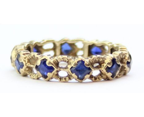 [2.36g, K] - 9ct gold and celtic style eternity ring set with blue stones, seemingly unmarked but XRF confirmed as 9ct gold
