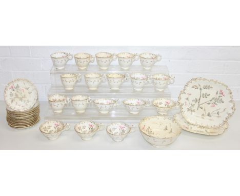 An antique cream and gilt tea service with floral decoration, likely 19th century, to incl cups and saucers, cake plate etc