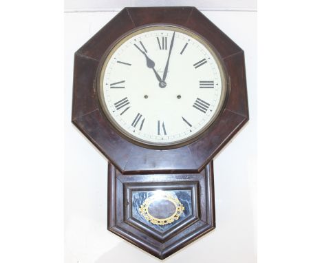 An antique wooden cased wall clock with octagonal case and drop dial, made by Ansonia, with key and pendulum, 65cm x 45cm