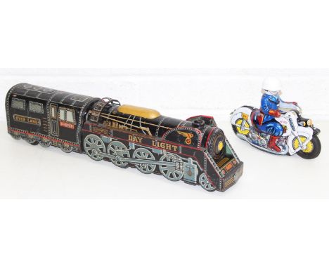 Two vintage Japanese tin plate toys to include 1960s Masudaya Over Land Express Train and Usagiya friction powered police mot