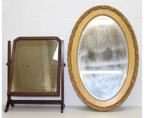 Large oval gilt-framed wall mirror in Art Nouveau details and a free-standing mahogany framed table mirror, largest 82cm x 56