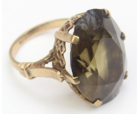 [10.11g, O] - a retro 9ct gold cocktail ring with large facet cut stone, likely a smokey quartz, marked 9ct and XRF confirmed