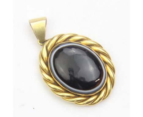A Victorian high carat gold with rope twist border mourning locket with bullseye agate front and photograph to back, unmarked