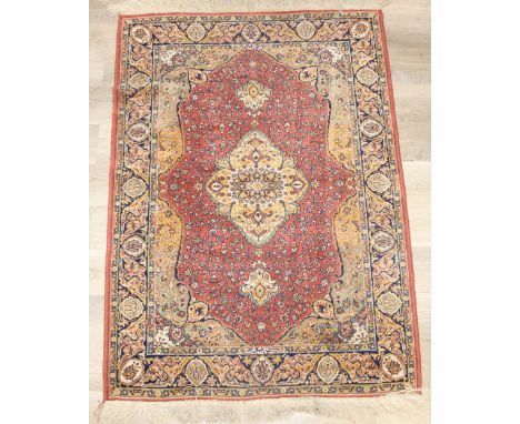 A vintage Heriz style rug of red ground, 150cm x 100cm