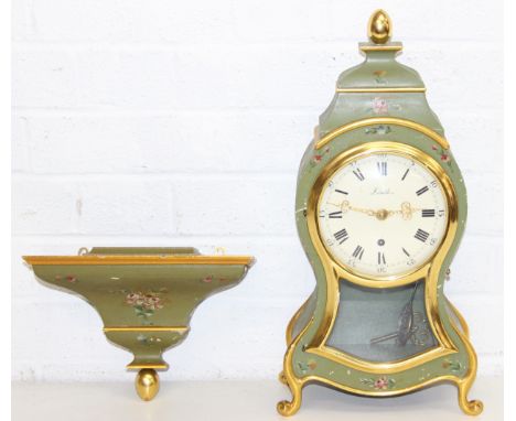 A Swiss made bracket clock with hand painted wooden body and gilt accents, with bracket-mount, Neuchatel style made by Zenith