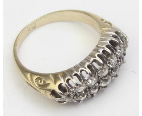[4.26g, K] - a vintage 9ct gold ring set with two rows of diamonds, twelve diamonds in total, each assessed as 0.1ct (1.2ct i