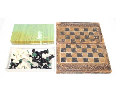 Vintage leather chess board box in the style of 2 large books and chess pieces 
