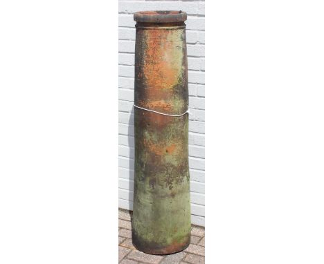 Very tall terracotta Windsor chimney pot with impressed detail near rim, 135cm tall