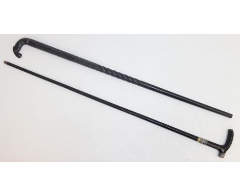 Two walking sticks, an African ebony stick with elephant carved handle, and an antique silver mounted ebonised stick, London 
