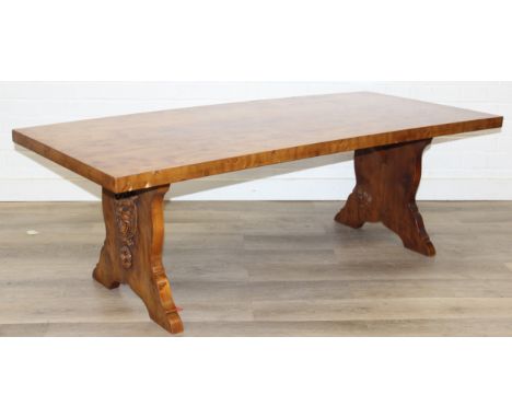 A superb quality modern coffee table with yew wood finish, lion mask adornments to legs, 143cm x 69cm x 51cm