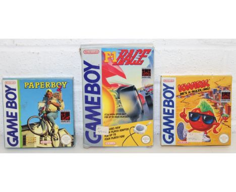 Nintendo Game Boy games: F1 Race with 4-player adapter, Paper Boy 2 (German packaging), and Kwirk, all with original boxes an